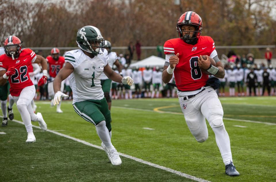 Southfield A&T quarterback Isaiah Marshall (8) runs the ball against Detroit Cass Tech during the second half of action in the MHSAA playoff game in Southfield on Saturday, Nov. 4, 2023.