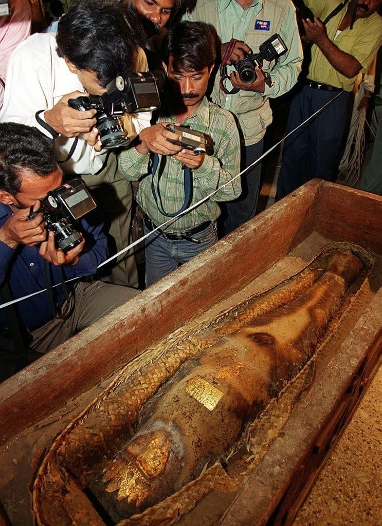 Photographers capturing a mummy