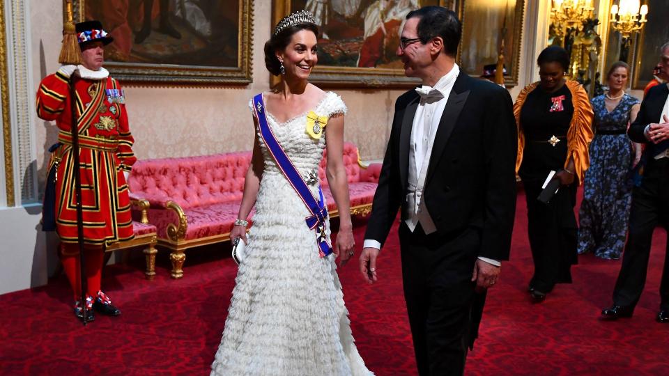 Kate Middleton wearing white dress and tiara