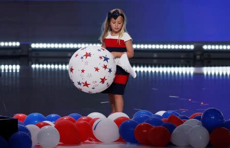 Grace Priebus, daughter of Republican National Committee Chair Reince Priebus, stands amid balloons onstage at the conclusion of the Republican National Convention in Cleveland, Ohio, U.S. July 21, 2016. REUTERS/Mike Segar