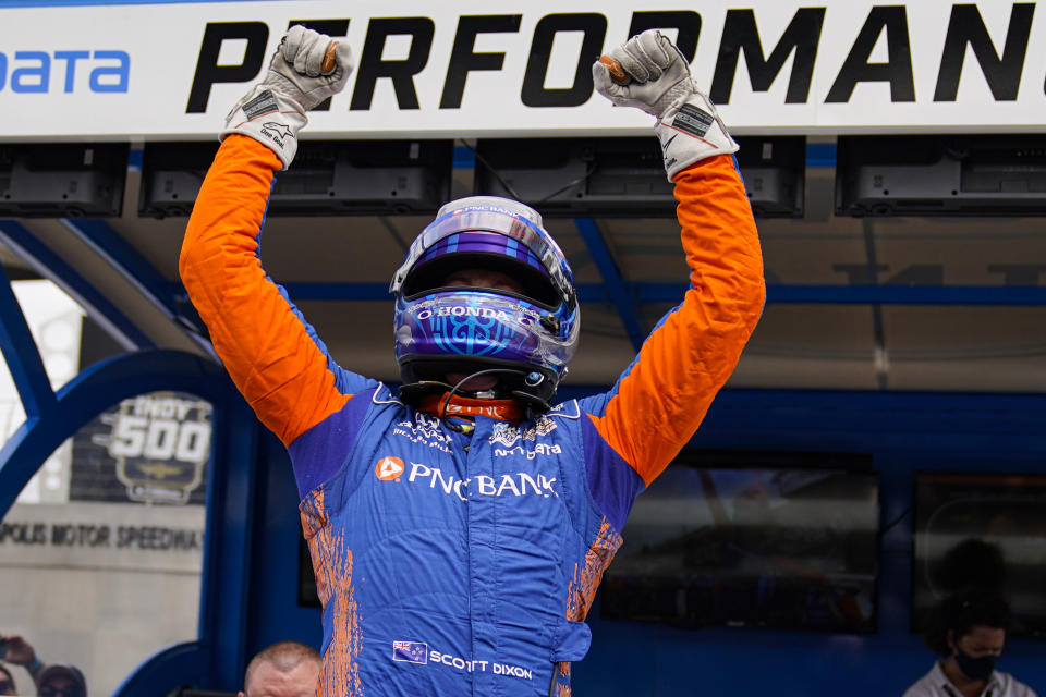 Scott Dixon, of New Zealand, celebrates after winning the pole during qualifications for the Indianapolis 500 auto race at Indianapolis Motor Speedway in Indianapolis, Sunday, May 23, 2021. (AP Photo/Michael Conroy)