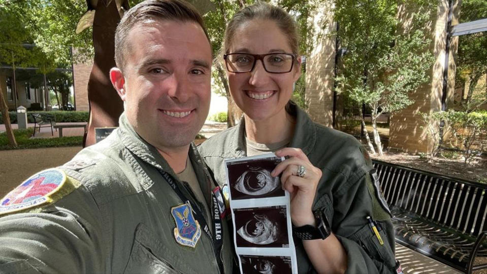 Lauren and Mark Olme pose with their baby's ultrasound. (Senior Airman Leon Redfern, 7th Bomb Wing Public Affairs)
