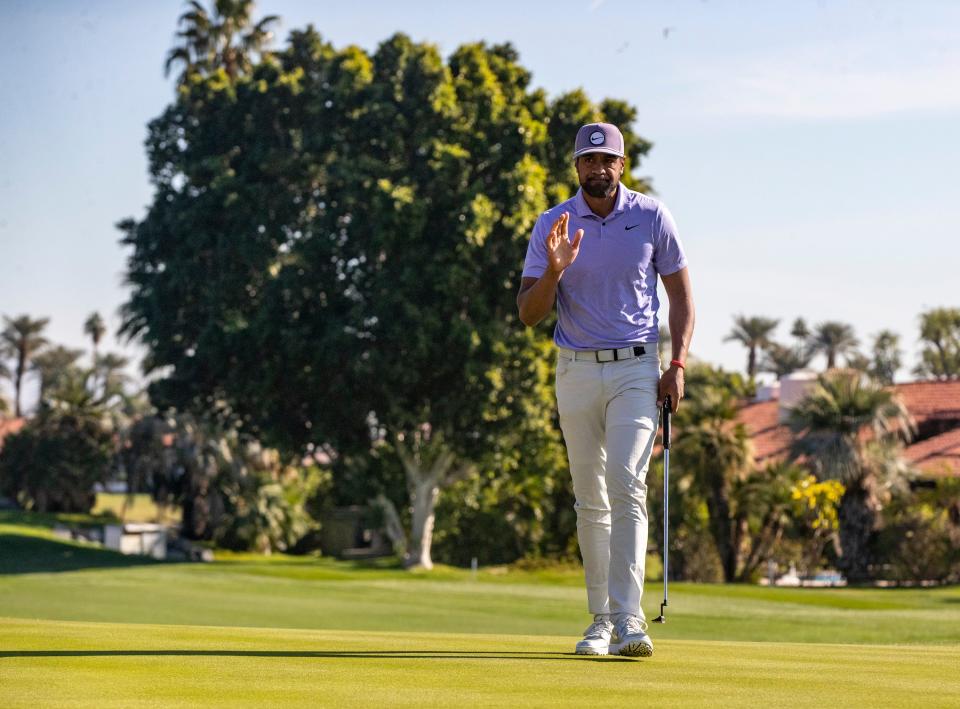Tony Finau waves to spectators after sinking a long putt on eight during Round 1 of The American Express at La Quinta Country Club in La Quinta, Calif., Thursday, Jan. 18, 2024.