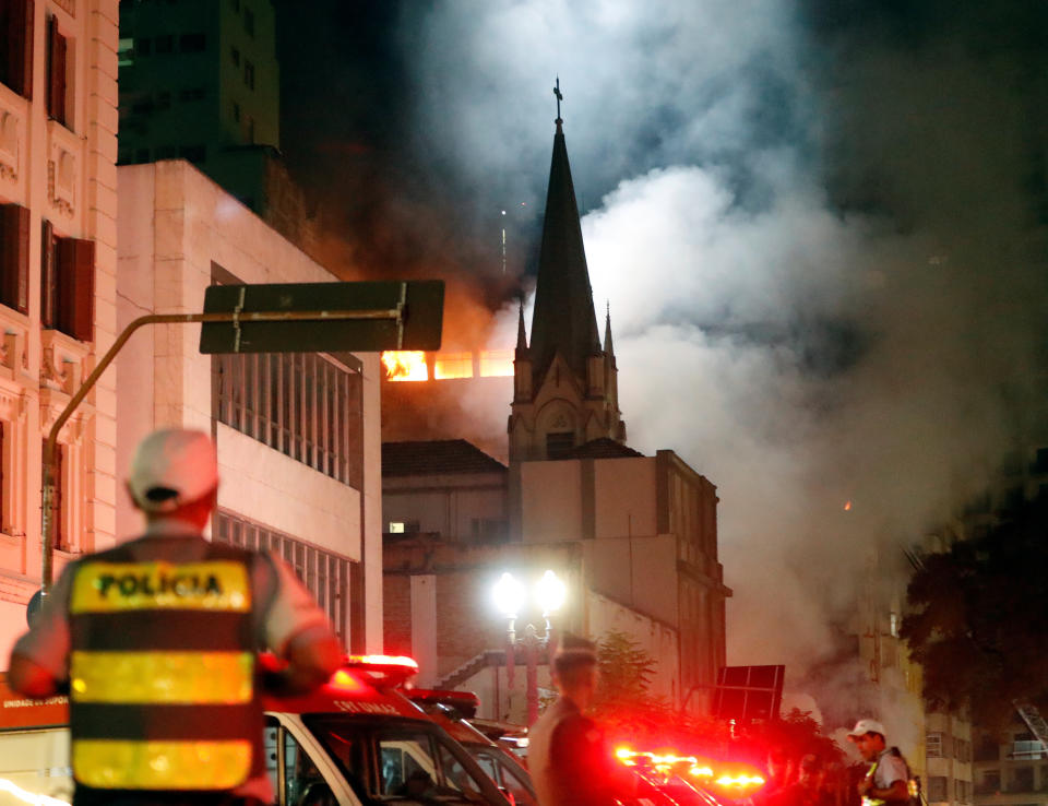 Burning high-rise collapses