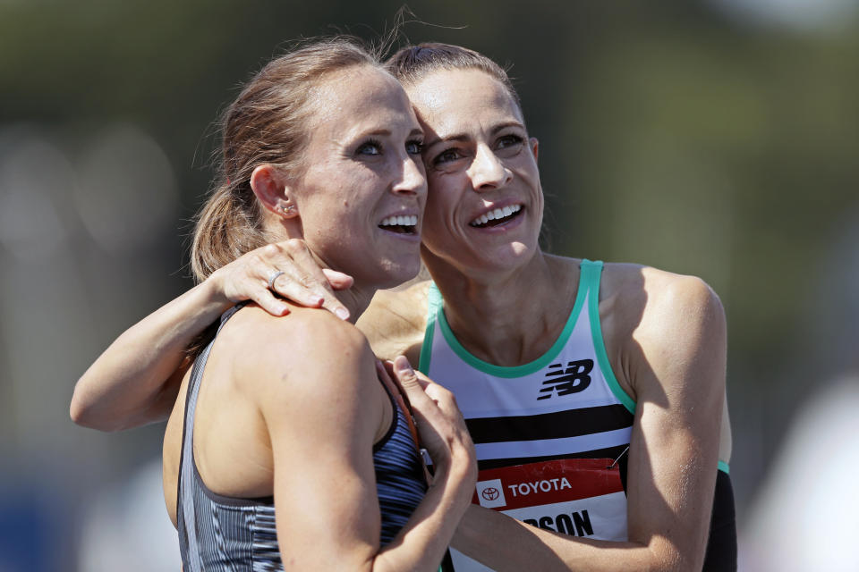 Shelby Houlihan gets a hug from Jenny Simpson, right, after winning the women's 1500-meter run at the U.S. Championships athletics meet, Saturday, July 27, 2019, in Des Moines, Iowa. (AP Photo/Charlie Neibergall)