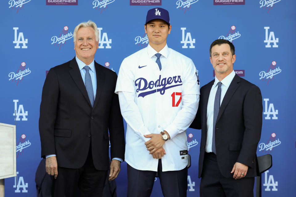 LOS ANGELES, CA - DECEMBER 14: Mark Walter and Andrew Friedman pose for a photo with Shohei Ohtani during the Shohei Ohtani Los Angeles Dodgers Press Conference at Dodger Stadium on Thursday, December 14, 2023 in Los Angeles, California. (Photo by Rob Leiter/MLB Photos via Getty Images)