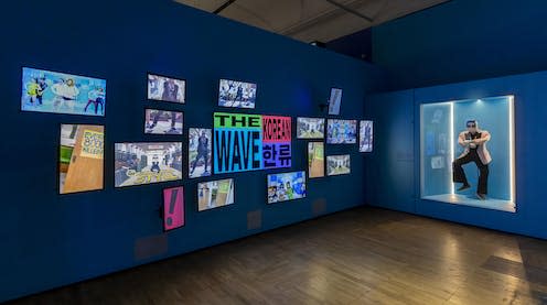<span class="caption">Installation image of exhibition introduction with PSY S Gangnam Style at Hallyu The Korean Wave at the V A Victoria and Albert Museum London</span> <span class="attribution"><span class="source">V&A</span></span>
