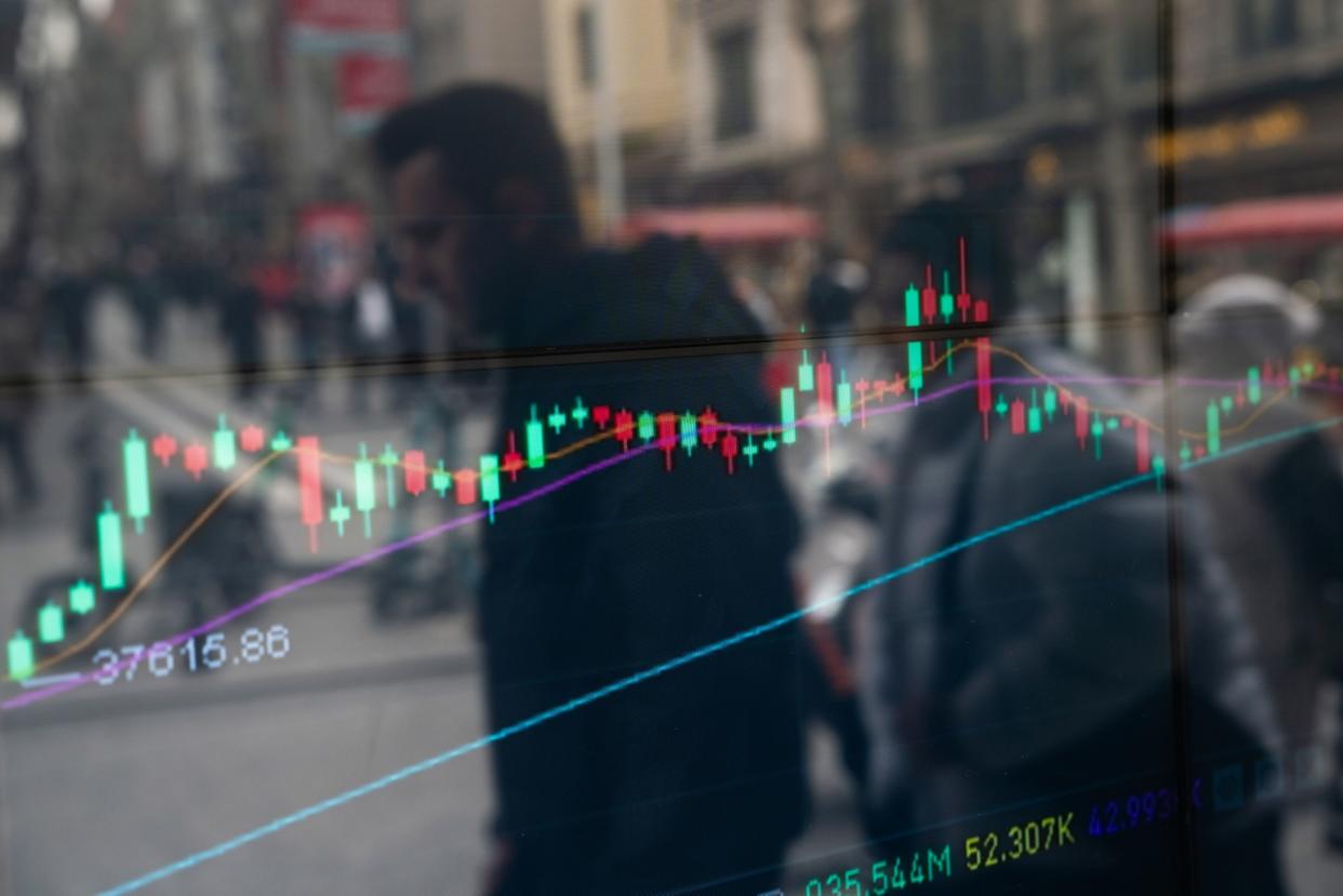 A candlestick price chart in the window of a cryptocurrency exchange bureau in Istanbul, Turkey, on Friday, March 1, 2024. . Photographer: David Lombeida/Bloomberg