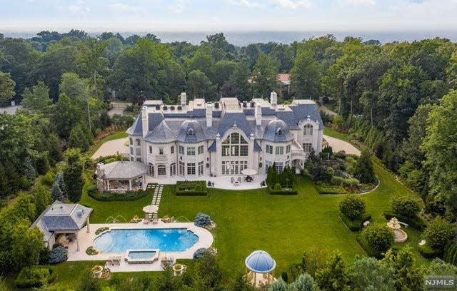 Chateau de la Roche, a home in Alpine, N.J., is about 25,700 square feet including a 15-seat theater, two bars, wine cellar, two indoor pools and a garden path that surrounds the backyard. For sale by Christie's International Real Estate Group-Mahwah/Saddle River Regional Office, it's listed for $22.5 million.