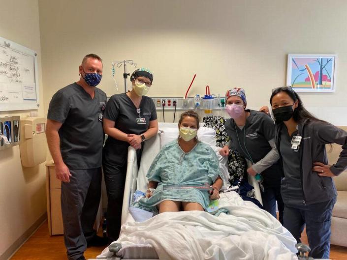  Brettlynn Wolff is shown with her care team at Jackson South Hospital, where she stayed for five weeks. Dr. Andrew Pastewski is on the left.