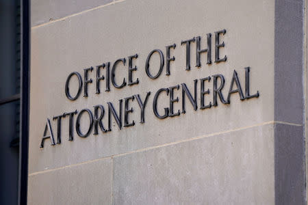 A sign of the Office of the Attorney General is displayed on the Department of Justice building the day after Special Counsel Robert Mueller delivered his report into Russia's role in the 2016 U.S. election and any potential wrongdoing by President Donald Trump in Washington, U.S., March 23, 2019. REUTERS/Joshua Roberts