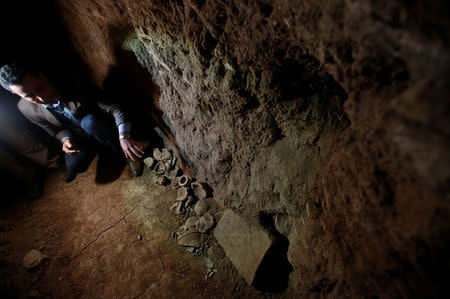 Archaeologist Musab Mohammed Jassim shows artefacts and archaeological pieces in a tunnel network running under the Mosque of Prophet Jonah, Nabi Yunus in Arabic, in eastern Mosul, Iraq March 9, 2017. Picture taken March 9, 2017. REUTERS/Suhaib Salem