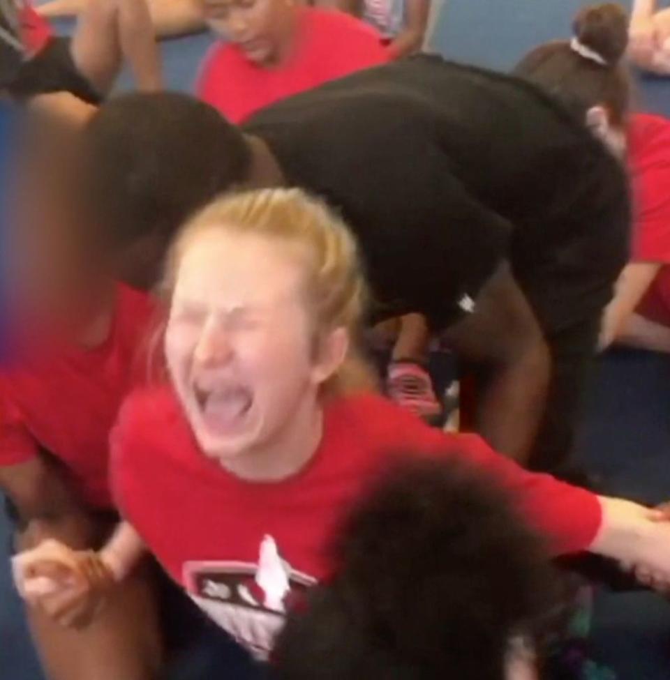Shocking video of a 13-year-old girl being forced into splits has led to a police investigation. (Photo: CBS News)