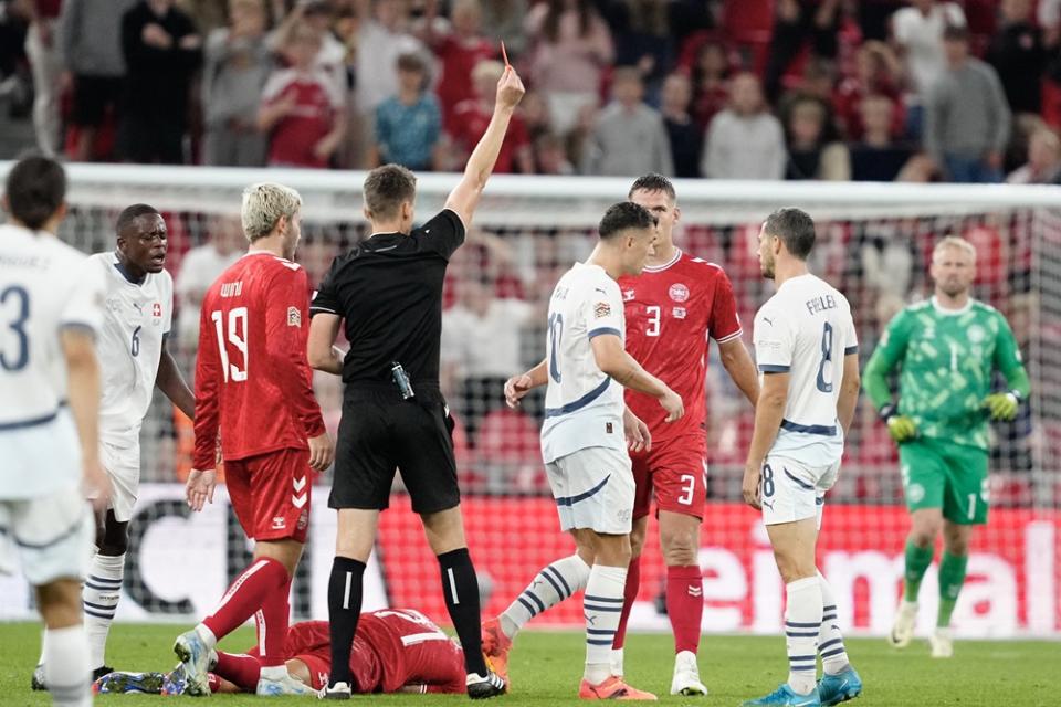 Switzerland's Granit Xhaka (4th) receives a red card from the referee during the UEFA Nations League League A, Group A4, Matchday 1 football match, Denmark v Switzerland at Parken Stadium in Copenhagen, Denmark on September 5, 2024. (Photo by MADS CLAUS RASMUSSEN/Ritzau Scanpix/AFP via Getty Images)