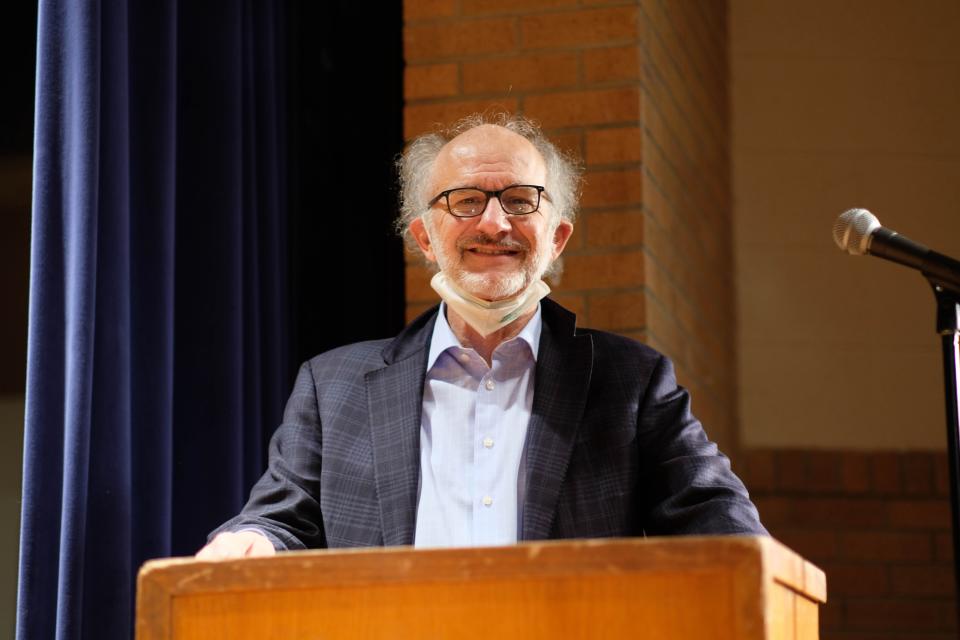 Dr. Steve Urban  host of the Potter County Spelling Bee looks on from the lectern Thursday after the competition.