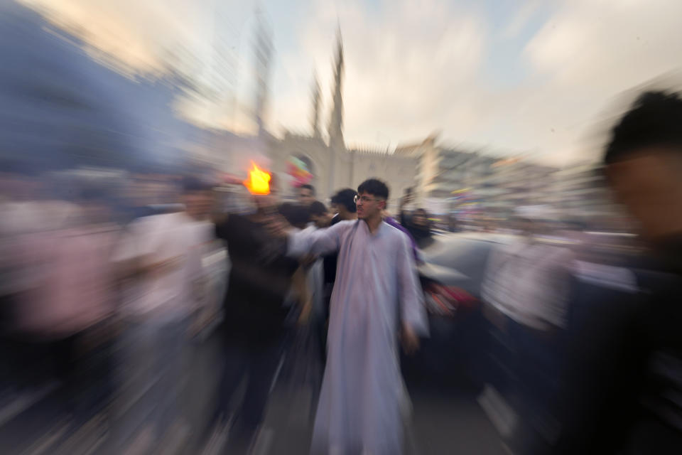 Muslims celebrate Eid al-Fitr, marking the end of the Muslim holy fasting month of Ramadan outside al-Seddik mosque in Cairo, Egypt, Wednesday, April 10, 2024. (AP Photo/Amr Nabil)