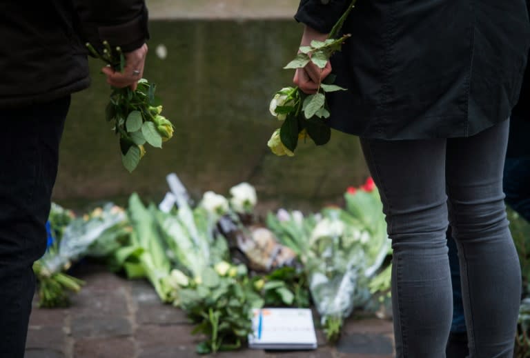 People lay flowers in honour of the shooting victims outside the synagogue Krystalgade in Copenhagen, in February 2015 after two fatal attacks in the Danish capital