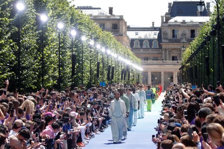 Models present creations by designer Virgil Abloh as part of his Spring/Summer 2019 collection show for Louis Vuitton fashion house during Men's Fashion Week in Paris, France, June 21, 2018. REUTERS/Charles Platiau