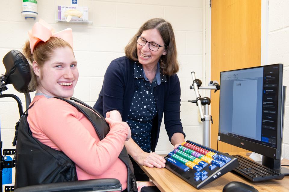 Matheny School student Emma Webster works with Donna Kelly, Matheny’s director of occupational therapy.