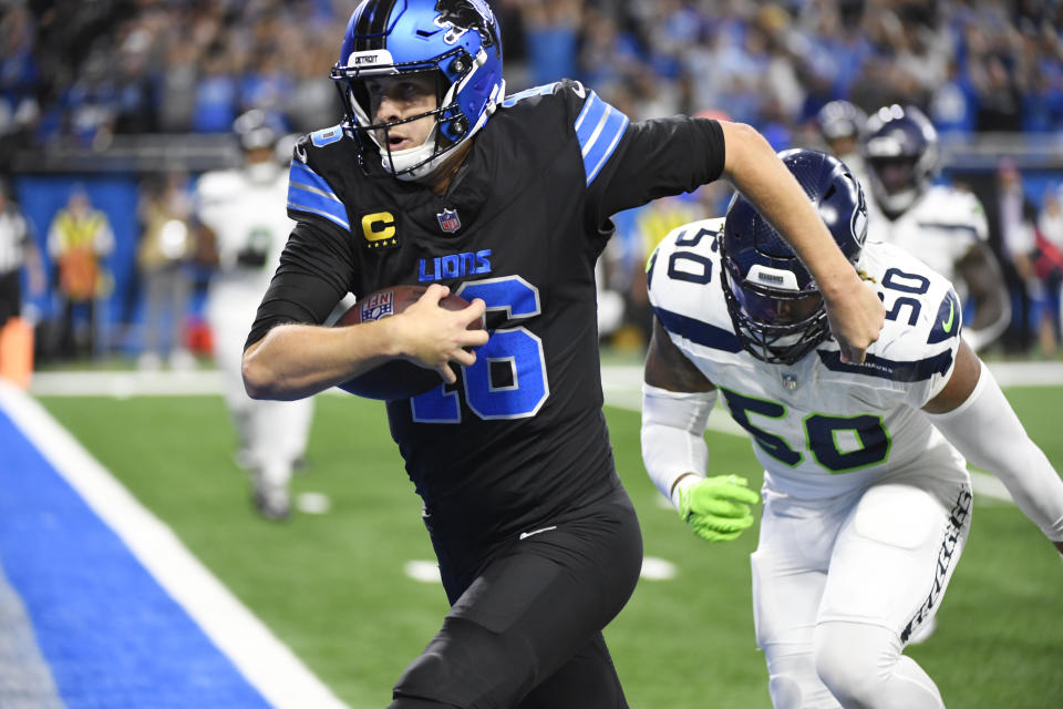 Detroit Lions quarterback Jared Goff runs after a 7-yard reception for a touchdown during the second half of an NFL football game against the Seattle Seahawks, Monday, Sept. 30, 2024, in Detroit. (AP Photo/Jose Juarez)