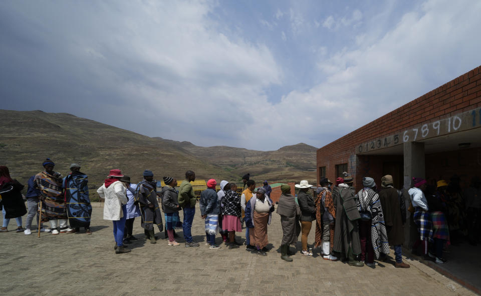 People line up to cast their votes at a polling station in That-Tseka District, 82km away from Maseru, Lesotho, Friday, Oct. 7, 2022. Voters across Lesotho are heading to the polls Friday to elect a leader to find solutions to high unemployment and crime. (AP Photo/Themba Hadebe)