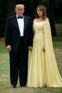 <p>The First Lady wore an off-the-shoulder caped gown designed by J. Mendel to a black-tie dinner at Blenheim Palace while on a two-day visit with the President to the UK.</p>