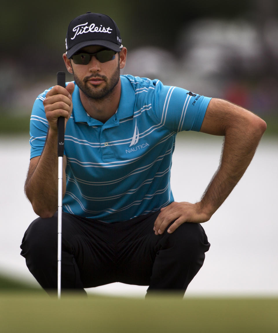 Cameron Tringale looks to putt on the eighteenth green during the third round of the Houston Open golf tournament on Saturday, April 5, 2014, in Humble, Texas. (AP Photo/Patric Schneider)