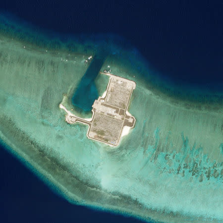 Satellite photo dated April 6, 2018 shows Cuarteron Reef, also known as Calderon Reef. Planet Labs Inc/Handout via REUTERS