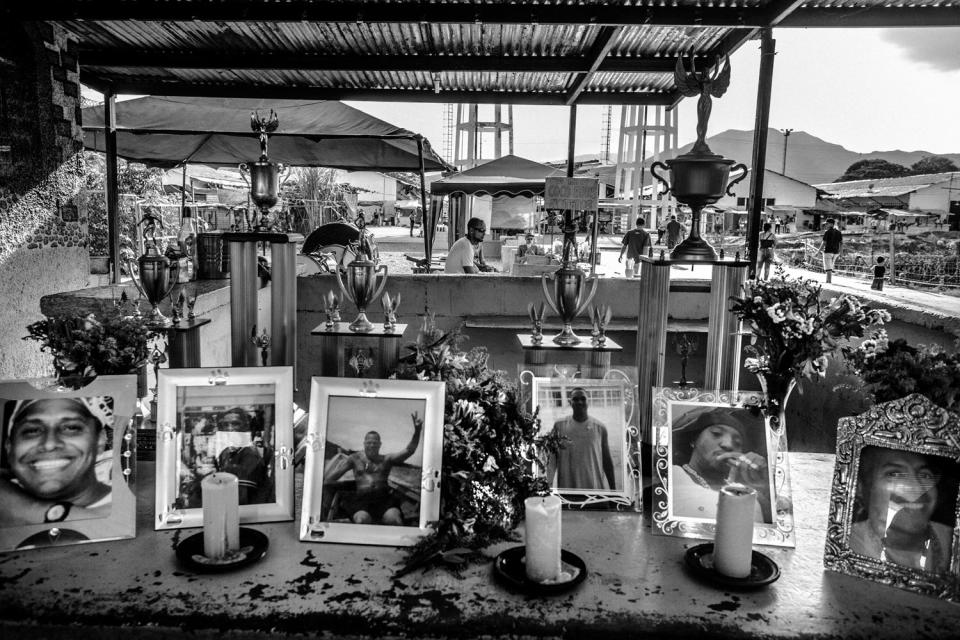 An outdoor display of pictures and trophies.