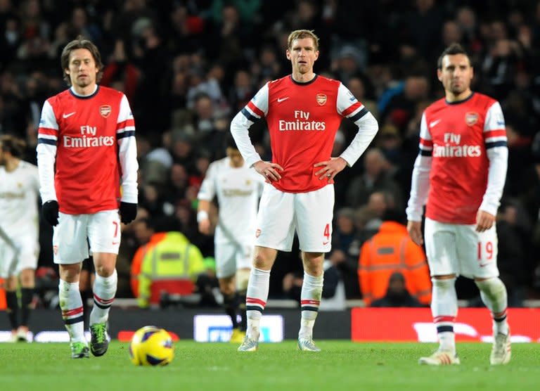 Arsenal's German defender Per Mertesacker reacts during an English Premier League football match on December 1, 2012. Mertesacker insists Arsenal will focus on Blackburn in the FA Cup, just 72 hours before German giants Bayern Munich arrive in north London for a last 16 Champions League first leg clash