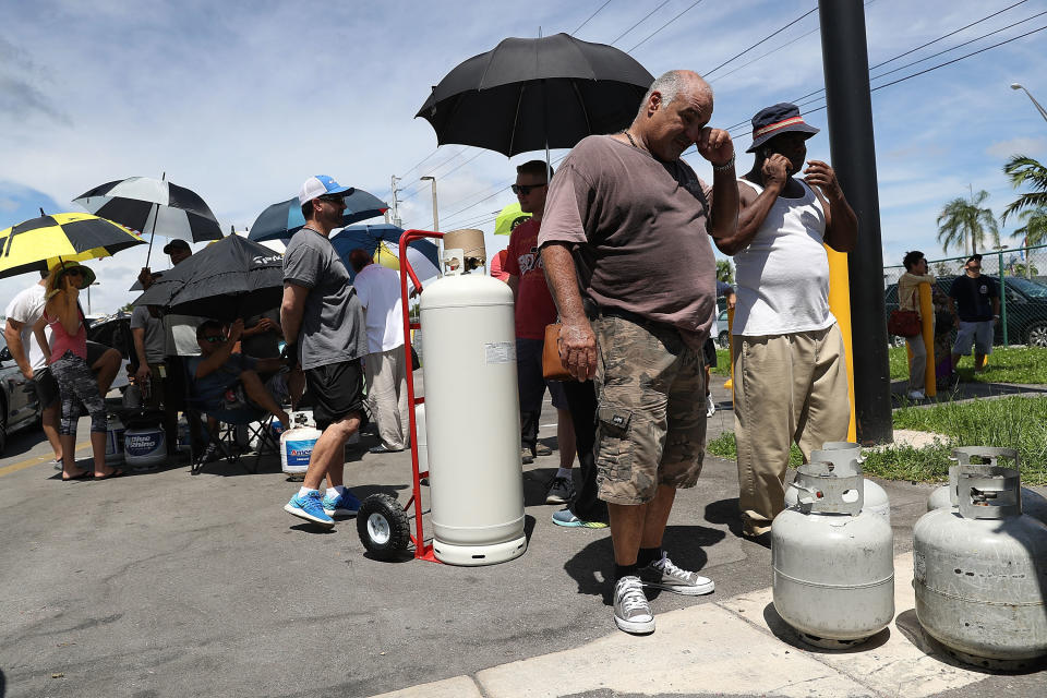 People line up to get their propane tanks filled as they prepare for Hurricane Irma in Miami.