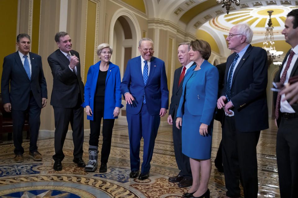 Senate Majority Leader Chuck Schumer, D-N.Y., center, is joined by his team following the Senate Democratic Caucus leadership election, at the Capitol in Washington, Thursday, Dec. 8, 2022. From left are, Sen. Joe Manchin, D-W.Va., who will be vice chair of the Democratic Policy and Communications Committee, Sen. Mark Warner, D-Va., and Sen. Elizabeth Warren, D-Mass., who will be vice chairs of the Senate Democratic Conference, Sen. Schumer who will remain as Senate Democratic leader and chair of the Democratic Conference, Senate Majority Whip Dick Durbin, D-Ill., will continue in that role, Sen. Amy Klobuchar, D-Minn., who will chair the Senate Democratic Steering Committee, Sen. Bernie Sanders, I-Vt., who will be the Outreach chair, and Sen. Brian Schatz, D-Hawaii, who will be deputy secretary of the Democratic Conference. (AP Photo/J. Scott Applewhite)