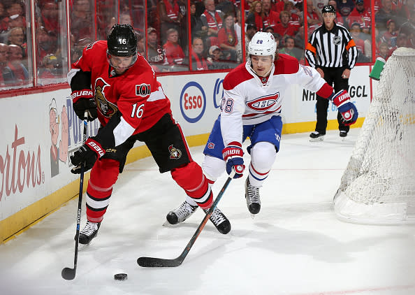 OTTAWA, ON - OCTOBER 11: Clarke MacArthur #16 of the Ottawa Senators controls the puck against Nathan Beaulieu #28 of the Montreal Canadiens at Canadian Tire Centre on October 11, 2015 in Ottawa, Ontario, Canada. (Photo by Andre Ringuette/NHLI via Getty Images)