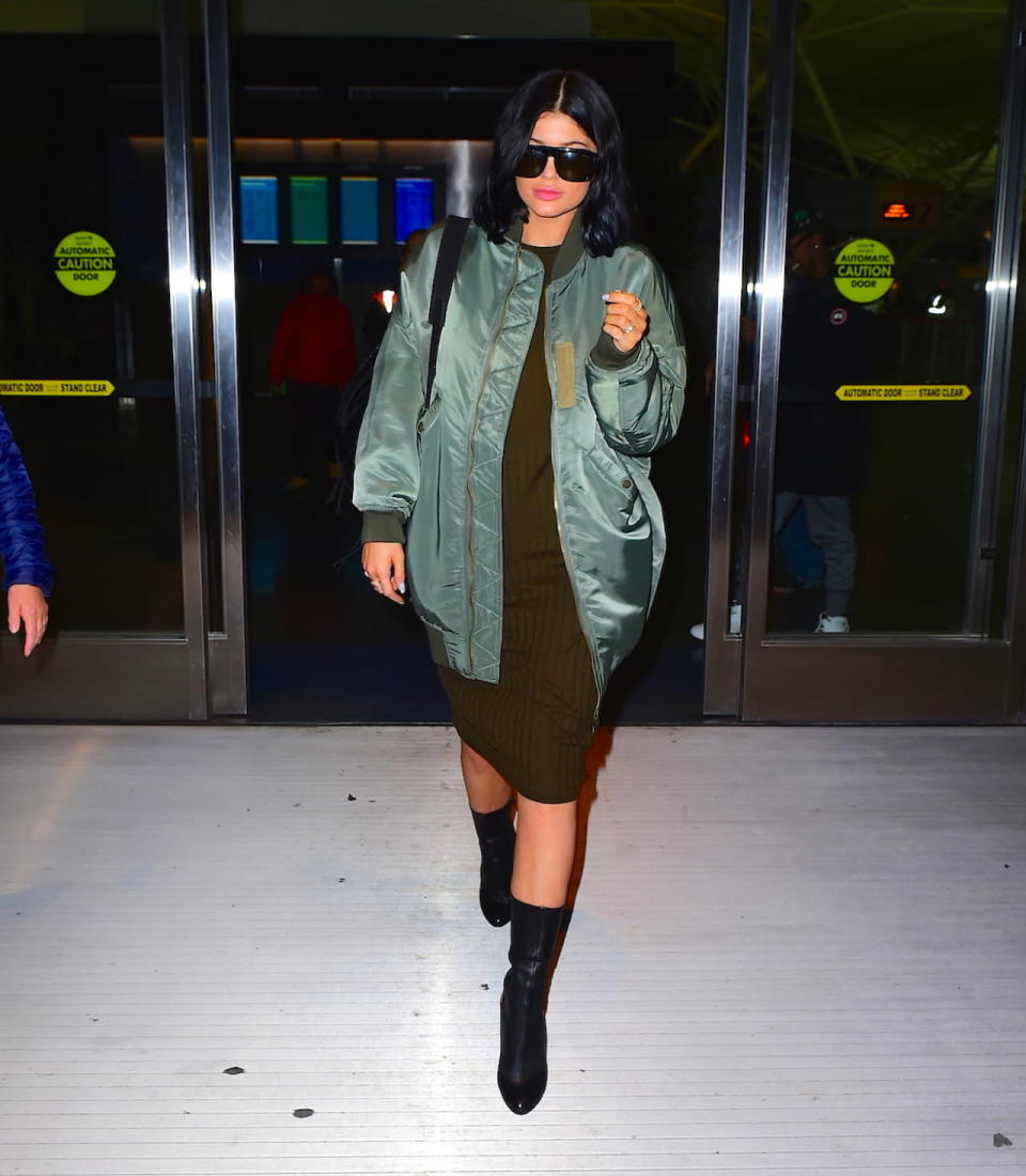 Kylie Jenner wears an elongated bomber jacket with a bodycon dress in L.A.