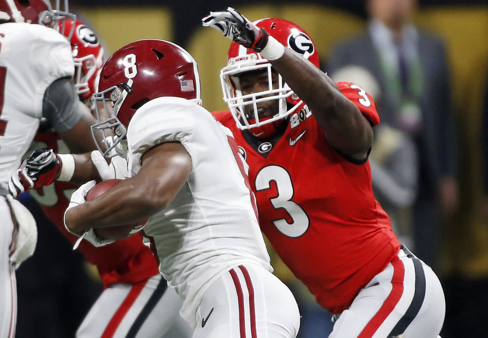 Linebacker Roquan Smith, the Bears' first-round pick, makes a tackle in the College Football Playoff title game. (AP)