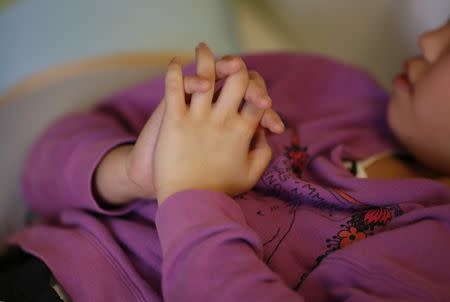 A nine-year-old girl who spent more than three months in a temporary shelter in Tokyo after being reported as a victim of abuse, is pictured at her psychotherapist's office in Tokyo, Japan March 17, 2017. Picture taken March 17, 2017. REUTERS/Toru Hanai