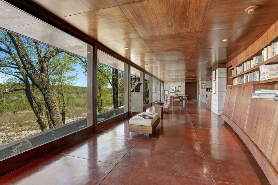 11) In addition to Frank Lloyd Wright's signature red flooring, there are river views.
