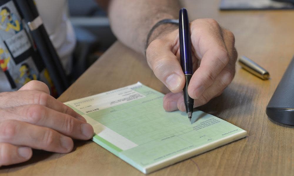 A doctor writing a prescription.