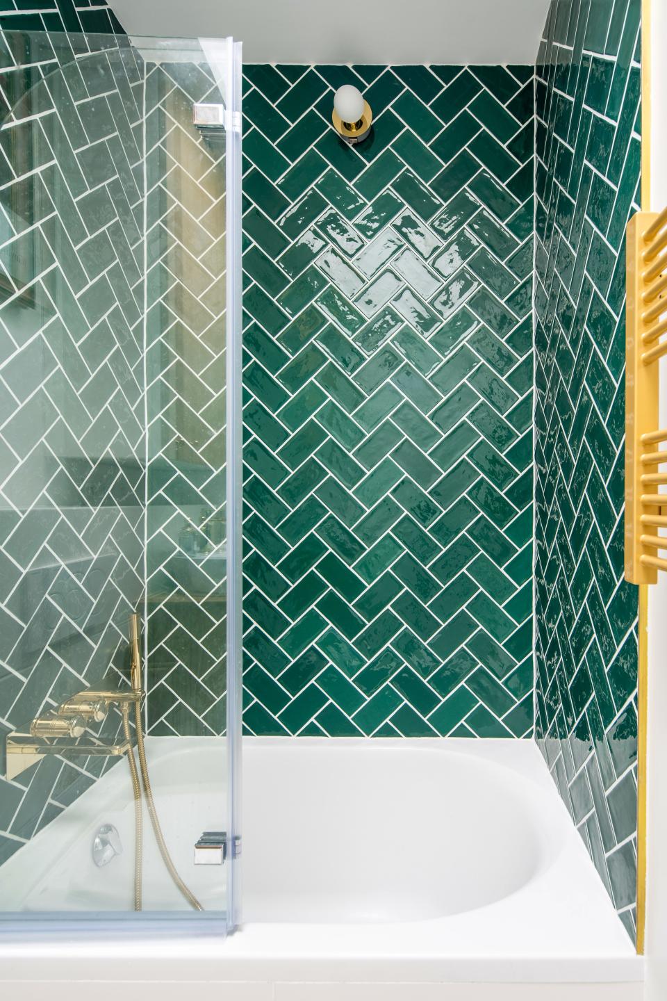 After: What Thomas calls a bâton rompu tiling is also known as the zigzag herringbone pattern. The rich emerald green echoes the accent walls in the rest of the space.