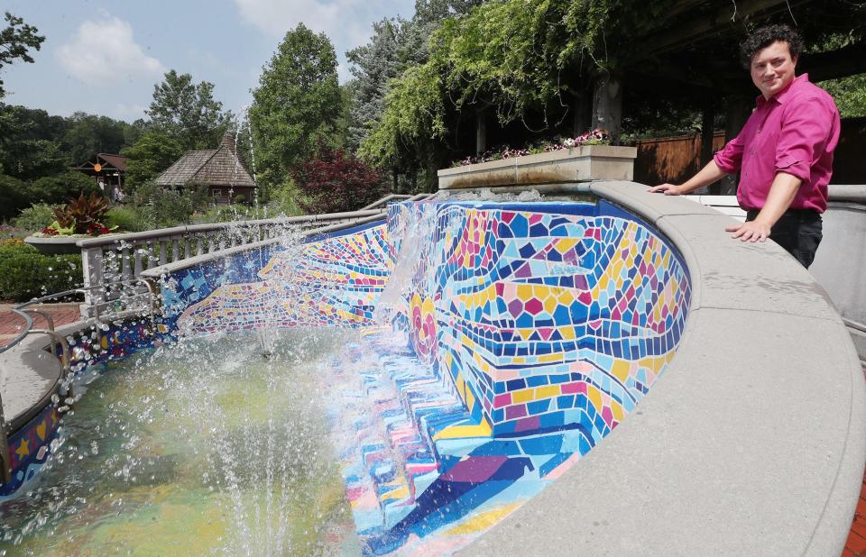 Local artist Mac Love, talks about the mural he painted in the fountain of the Lehner Family Zoo Gardens at the Akron Zoo.