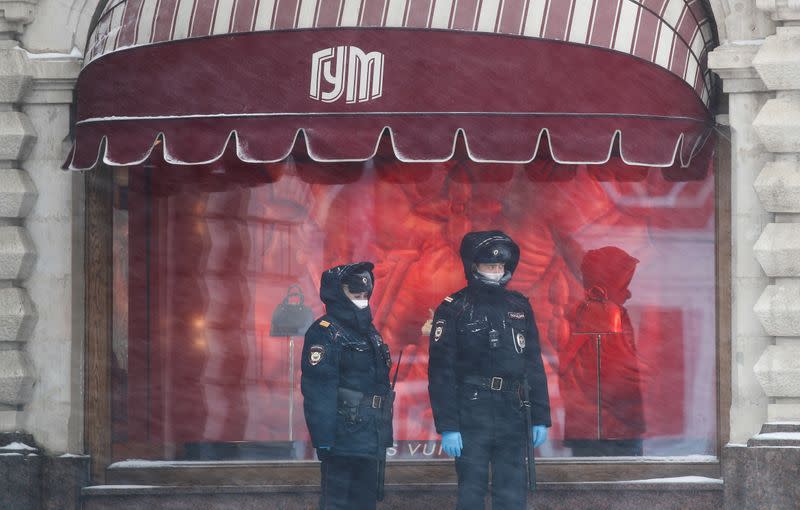 Police officers stand guard in Red Square in Moscow