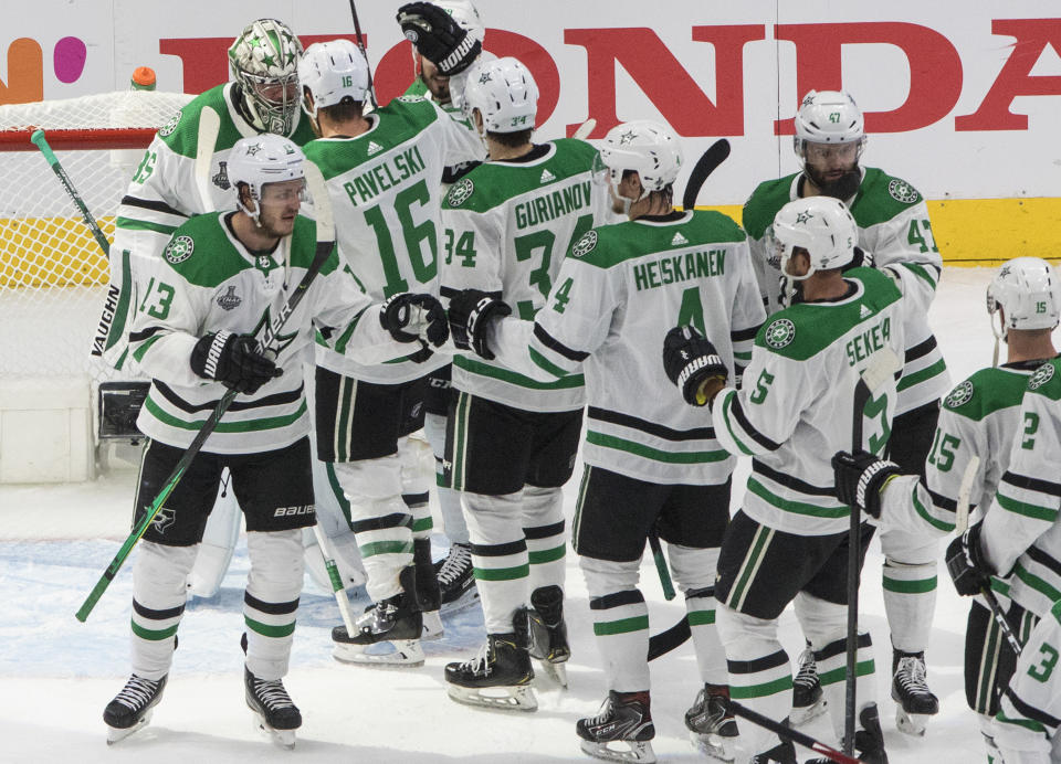 The Dallas Stars celebrate their win over the Tampa Bay Lightning in NHL Stanley Cup finals hockey action in Edmonton, Alberta, Saturday, Sept. 19, 2020. (Jason Franson/The Canadian Press via AP)