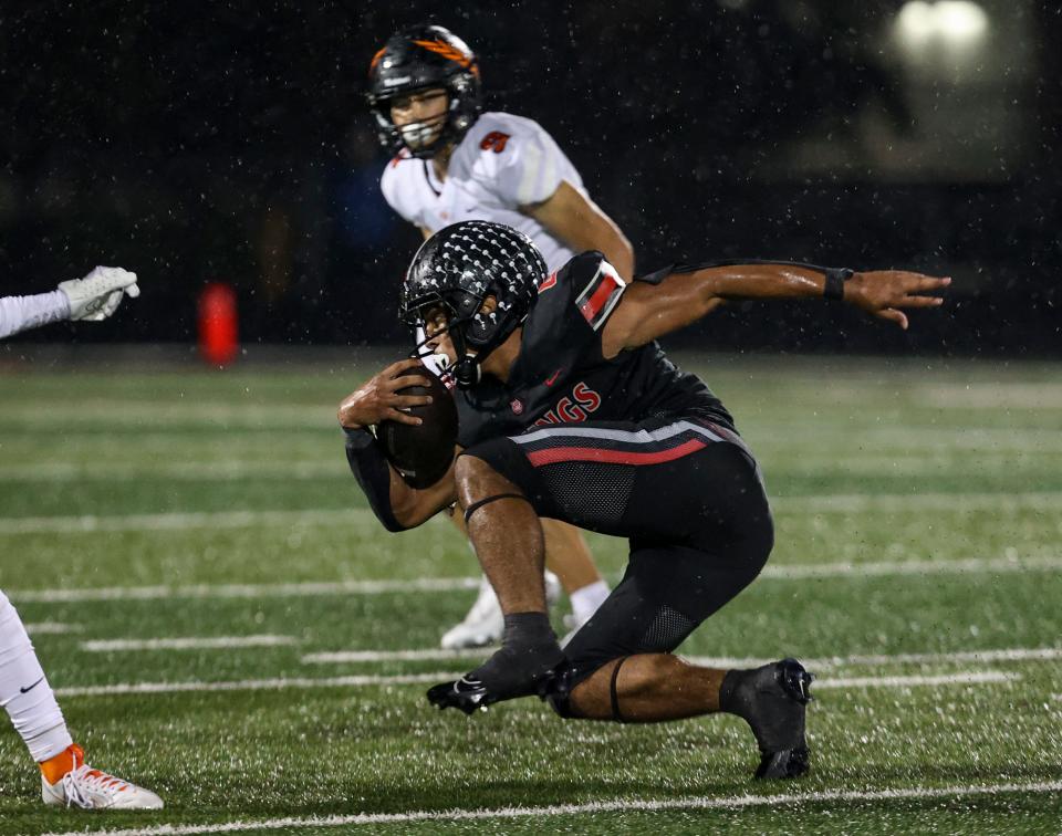 North Salem's Jamahl Wilson (4) finds an opening as he runs the ball during the game against Sprague on Friday, Oct. 13, 2023 in Salem, Ore.