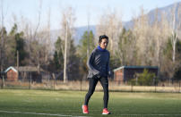 Olympic hopeful Maggie Montoya is shown as she trains with fellow runners at a park on the east side of Boulder, Colo., Friday, April 9, 2021. The 25-year-old distance runner was working in the pharmacy at the King Soopers supermarket in Boulder, Colorado, on March 22 when 10 people were killed, including a police officer, in a mass shooting. (AP Photo/David Zalubowski)