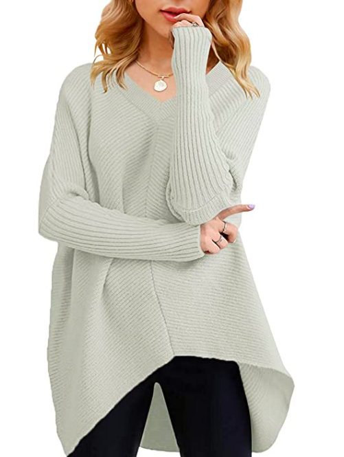 Model wears Womens V Neck Sweater with asymmetric hem in light grey