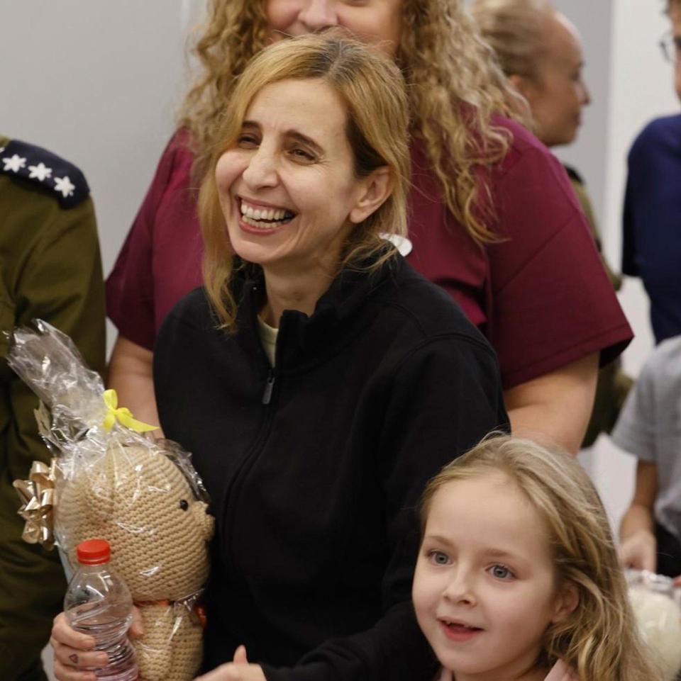 Six year-old Amelia Aloni and her mother are met by family members