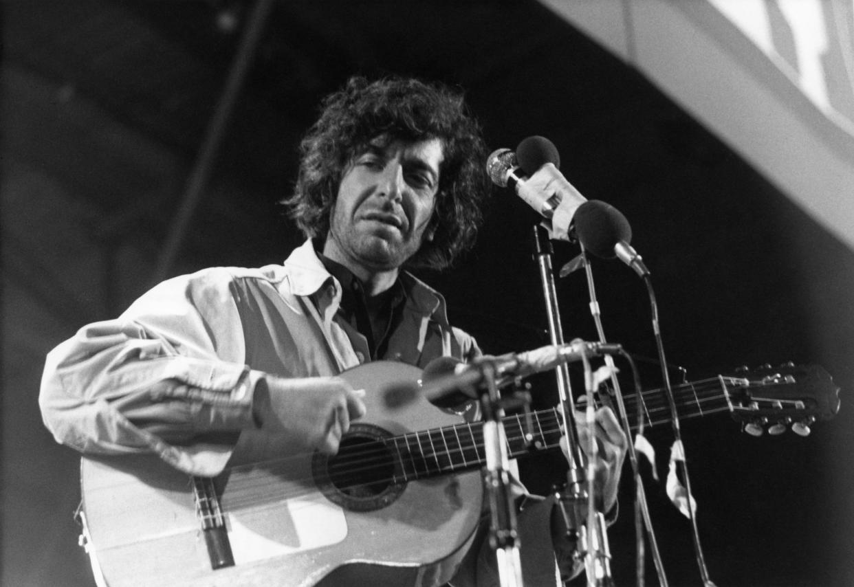 Canadian singer Leonard Cohen performs on stage at the Isle of Wight Festival on August 30 1970.