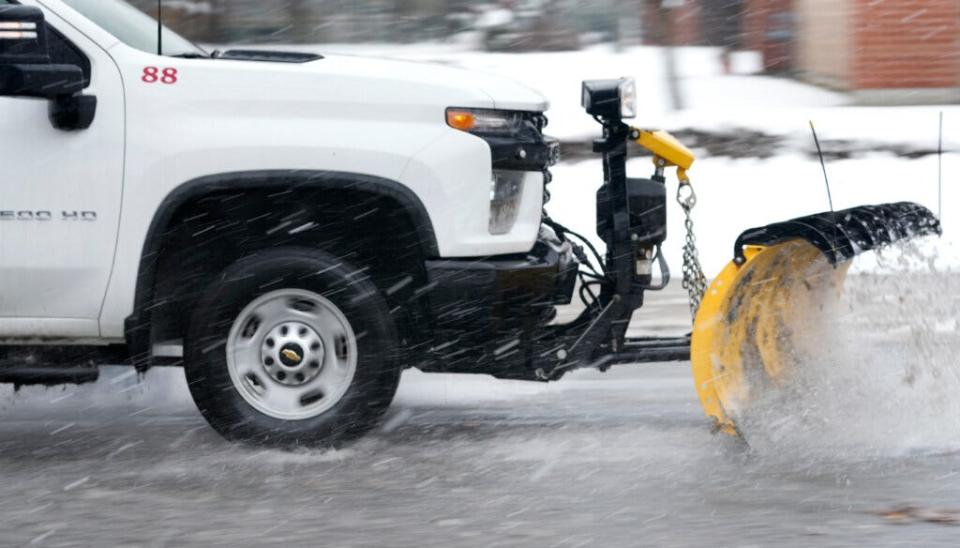 A plow clears snow and slush from an East Providence road last month. Snow and rain reports from volunteers help the National Weather Service get a fuller picture.