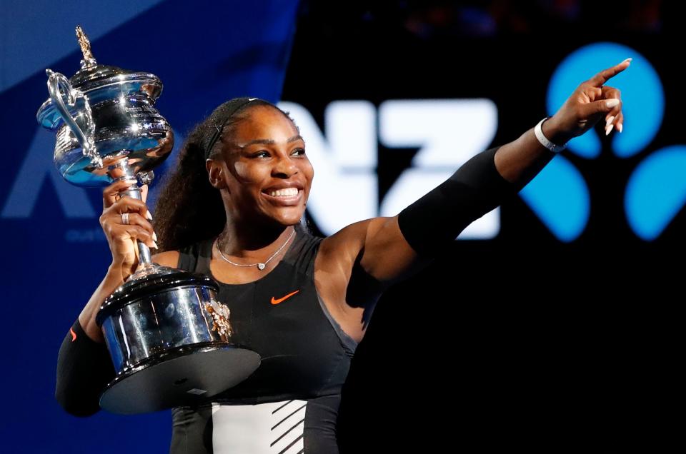 Serena Williams holds her trophy after defeating her sister Venus at the Australian Open in 2017, claiming her 23rd Grand Slam title.