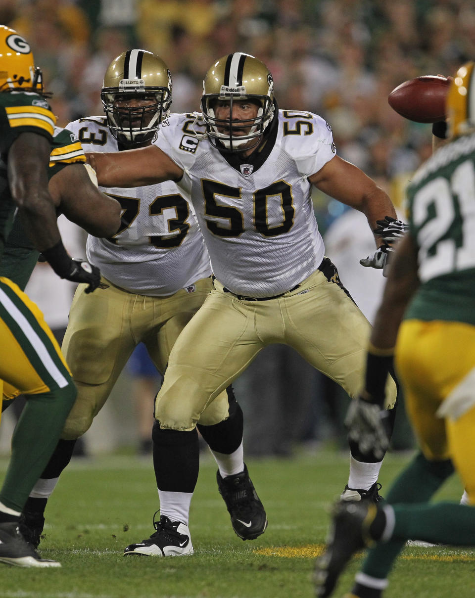 GREEN BAY, WI - SEPTEMBER 08: Olin Kreutz #50 of the New Orleans Saints moves to block against the Green Bay Packers during the NFL opening season game at Lambeau Field on September 8, 2011 in Green Bay, Wisconsin. (Photo by Jonathan Daniel/Getty Images)